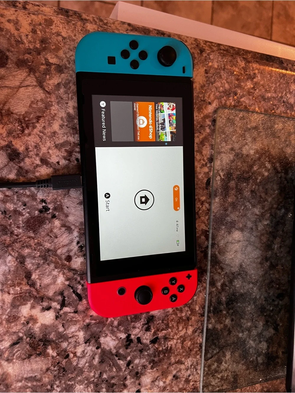 Nintendo Switch with Neon Blue and Neon Red Joy-Con